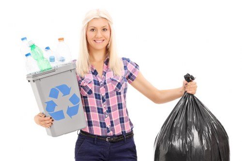 Staff at a house clearance site preparing to remove items